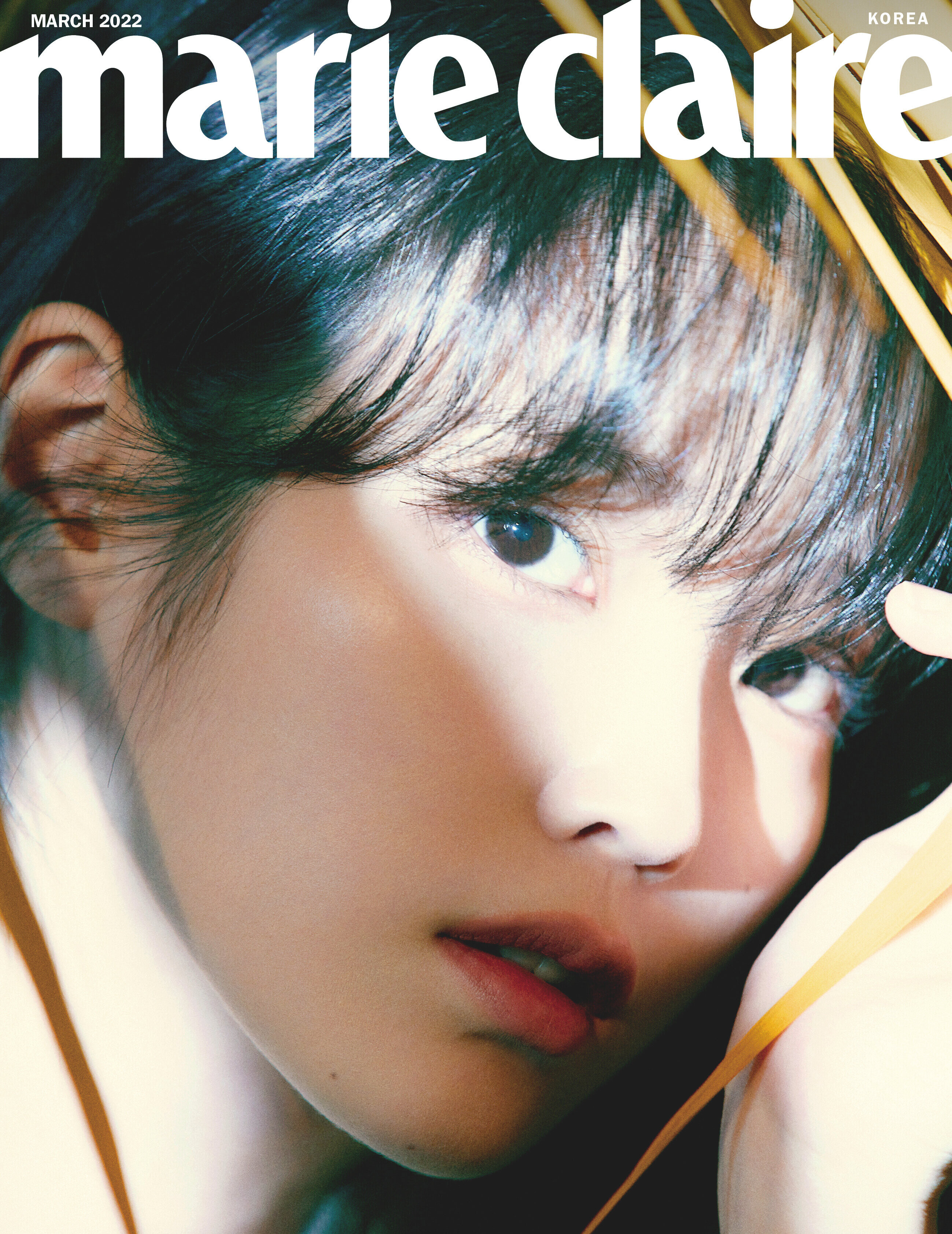 IU captivates with her mysterious gaze for 'Marie Claire